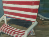 "Red & White Beach Chair" oil pastels on board - framed - by Nancy Carter
